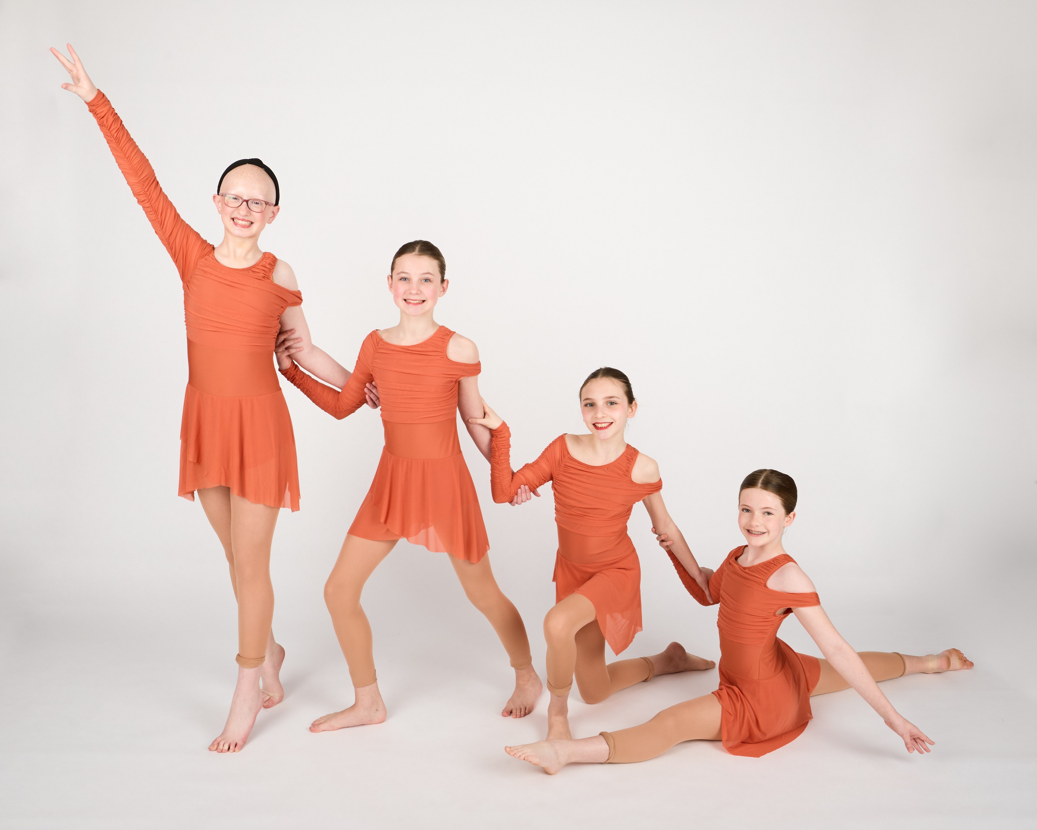 Dance Connections Company dancers posing together as a group