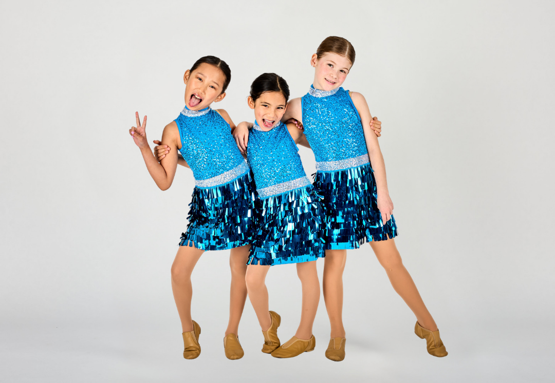 Three Dance Connections dancers in sparkling blue fringe costumes